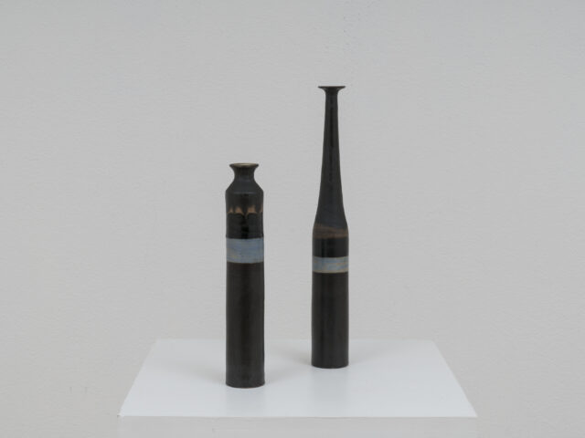 Pair of black ceramic bottles