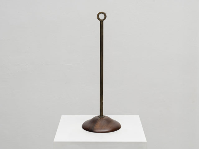 Wood and brass doorstop