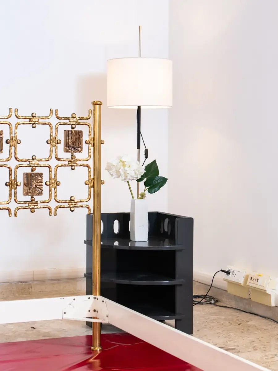 detail of pomodoro bed, oluce lamp, meneguzzo ceramic and gardella nightstand in 1+1 showroom for biennale arte 2026