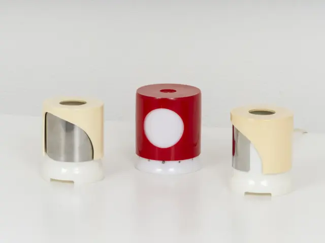 group of collectible italian space age table lamps, joe colombo for kartell,1964, cream and red perspex 