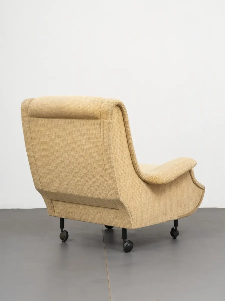 marco zanuso regent arflex — rear view showing sculptural upholstered shell and castors 