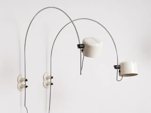 pair of joe colombo “coupé” arc wall lamps for o luce, designed 1967, white cylindrical shades and chromed steel arcs