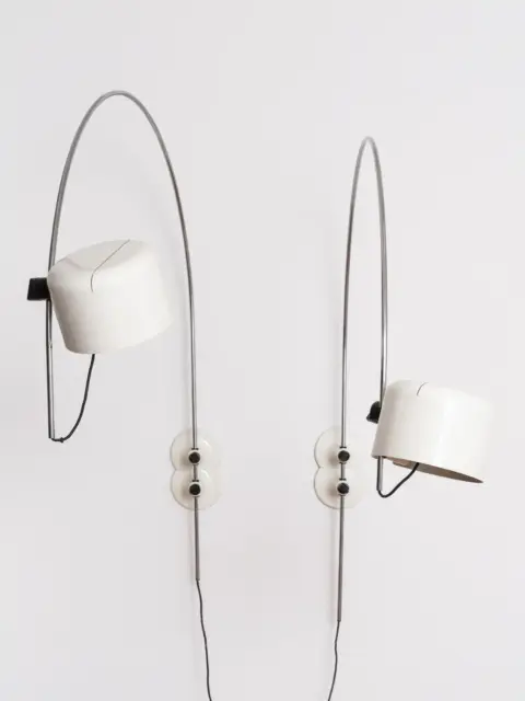 pair of joe colombo “coupé” arc wall lamps for o luce, designed 1967, white cylindrical shades and chromed steel arcs 