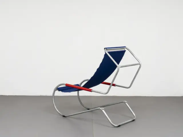 rear three quarter view of the lido chair by fratelli giudici, hexagonal backrest frame and base loop 